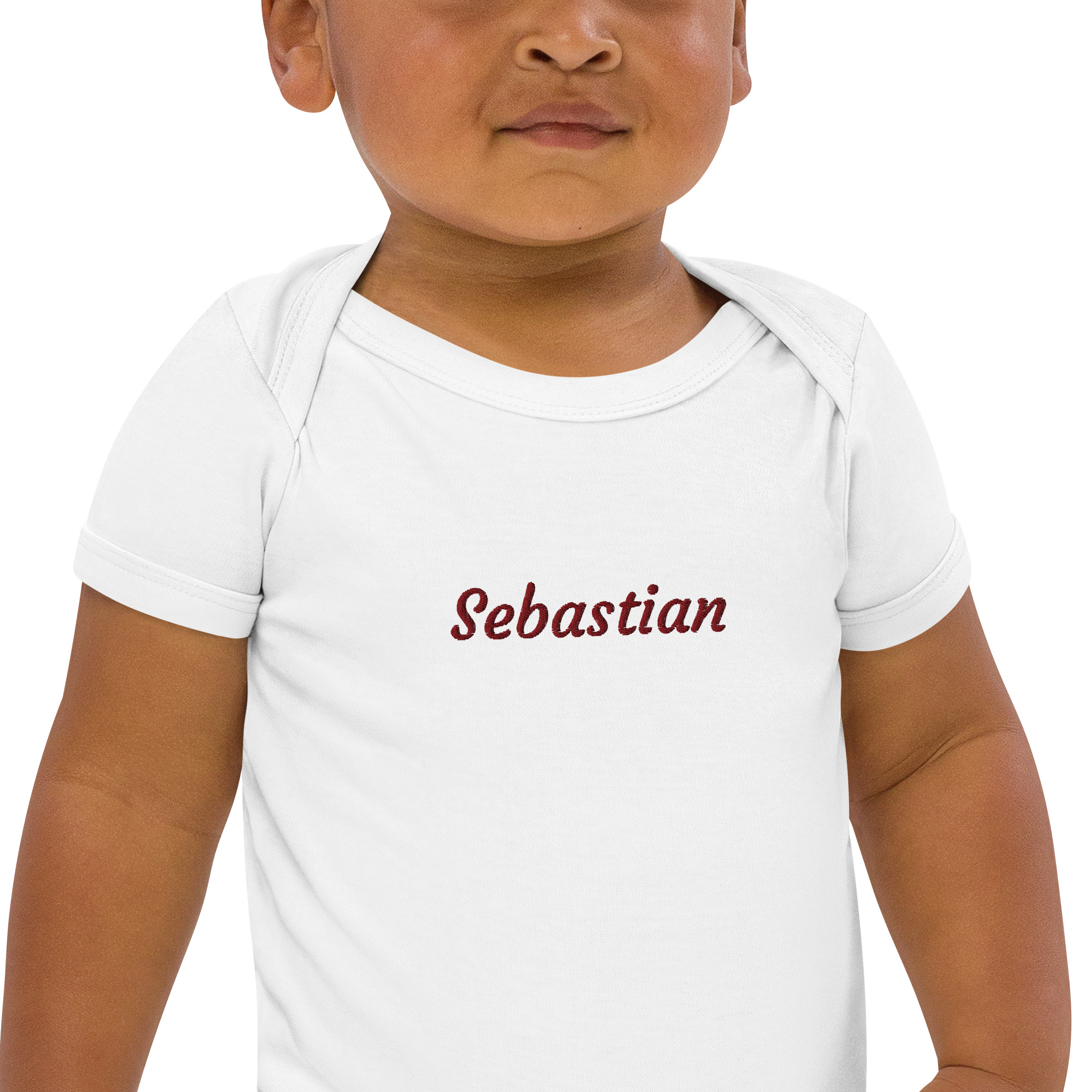 Baby wearing personalised bodysuit with name Sebastian